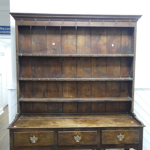 503 - A George III oak Dresser with plate rack, moulded cornice over frieze with hooks, above three panel ... 