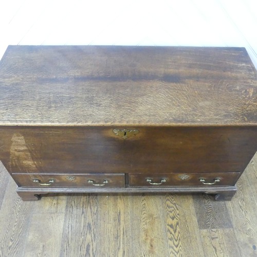 507 - An early Georgian oak mule Chest, rectangular top over two drawers raised on bracket feet, W 124 cm ... 