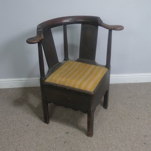 508 - A Georgian mahogany corner elbow Chair, raised on square supports, W 76 cm x H 83.5 cm x D 62 cm.... 