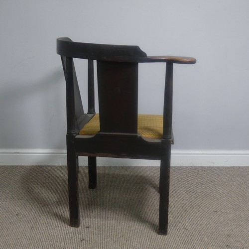 508 - A Georgian mahogany corner elbow Chair, raised on square supports, W 76 cm x H 83.5 cm x D 62 cm.... 