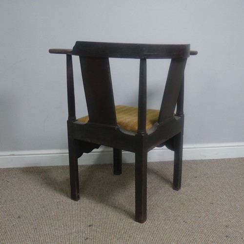 508 - A Georgian mahogany corner elbow Chair, raised on square supports, W 76 cm x H 83.5 cm x D 62 cm.... 