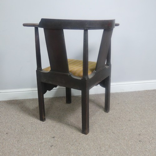 508 - A Georgian mahogany corner elbow Chair, raised on square supports, W 76 cm x H 83.5 cm x D 62 cm.... 