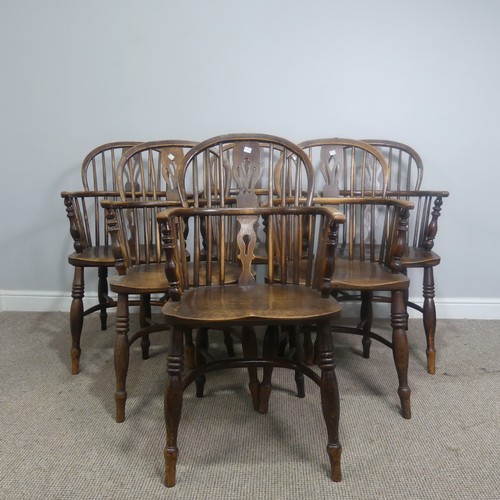 511 - A set of six 19th century ash and elm Windsor Armchairs, spindle and pierced splat backs over shaped... 