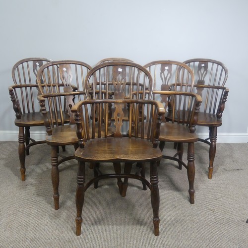 511 - A set of six 19th century ash and elm Windsor Armchairs, spindle and pierced splat backs over shaped... 