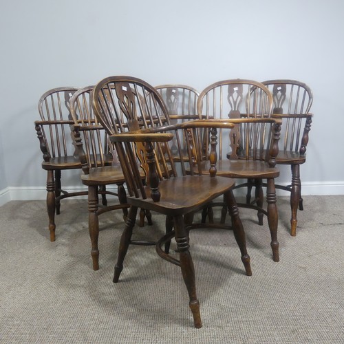 511 - A set of six 19th century ash and elm Windsor Armchairs, spindle and pierced splat backs over shaped... 