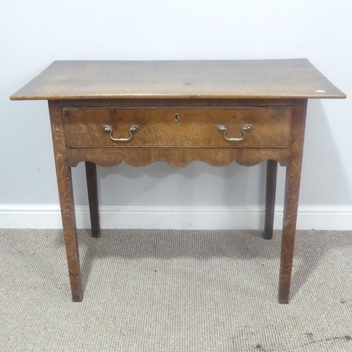 513 - A Georgian oak side Table, overhanging rectangular top over single drawer and moulded frieze, raised... 