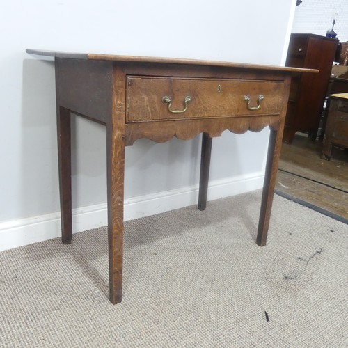 513 - A Georgian oak side Table, overhanging rectangular top over single drawer and moulded frieze, raised... 