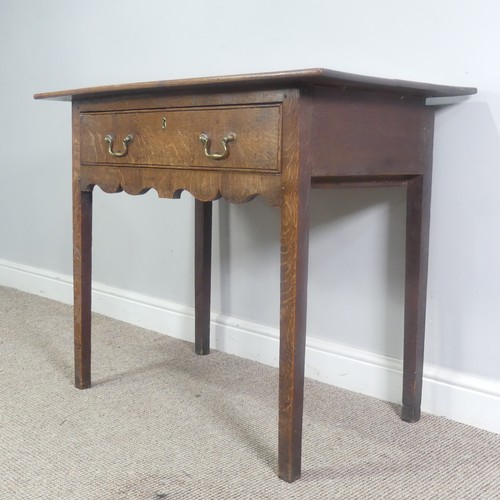 513 - A Georgian oak side Table, overhanging rectangular top over single drawer and moulded frieze, raised... 