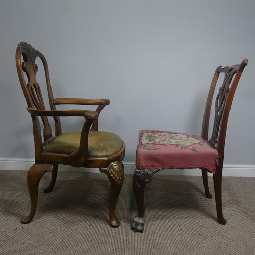 515 - An early 20th century Armchair, carved pediment and pierced splat flanked by moulded scrolled arms, ... 