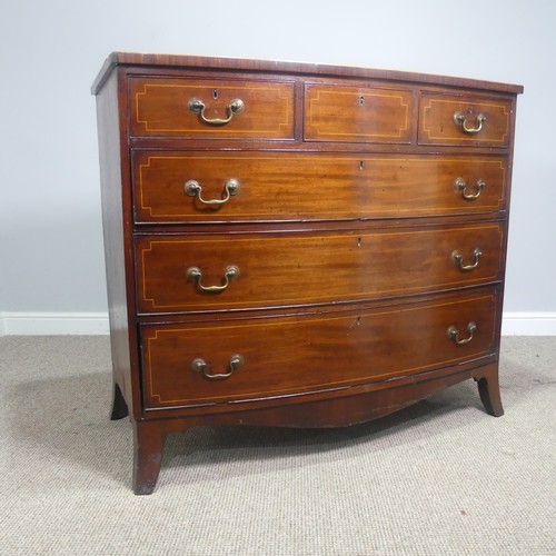 521 - A Georgian mahogany bow-front Chest of drawers, three small drawers over three long graduating drawe... 