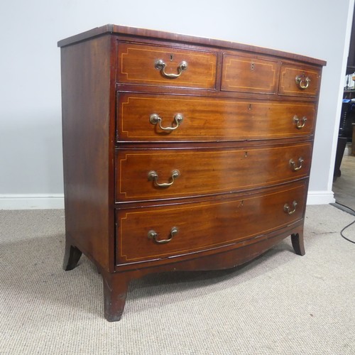 521 - A Georgian mahogany bow-front Chest of drawers, three small drawers over three long graduating drawe... 