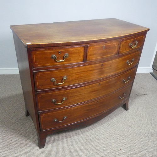 521 - A Georgian mahogany bow-front Chest of drawers, three small drawers over three long graduating drawe... 