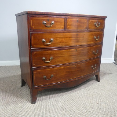 521 - A Georgian mahogany bow-front Chest of drawers, three small drawers over three long graduating drawe... 