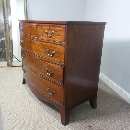 521 - A Georgian mahogany bow-front Chest of drawers, three small drawers over three long graduating drawe... 