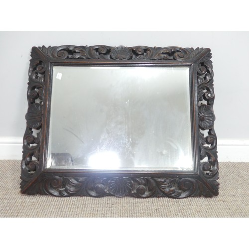 532 - An antique carved and pierced oak rectangular wall Mirror, W 76 cm x H 62 cm.