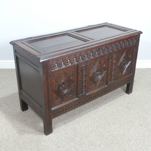 533 - A 17th century oak Coffer, two panelled rectangular top with original pin hinges, over three carved ... 