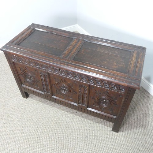 533 - A 17th century oak Coffer, two panelled rectangular top with original pin hinges, over three carved ... 