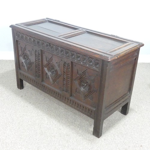 533 - A 17th century oak Coffer, two panelled rectangular top with original pin hinges, over three carved ... 