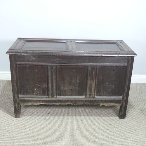 533 - A 17th century oak Coffer, two panelled rectangular top with original pin hinges, over three carved ... 