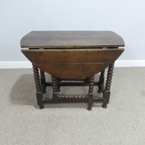 536 - A small 18th century oak gateleg circular Table, raised on turned bobbin supports, W 99 cm x H 73 cm... 