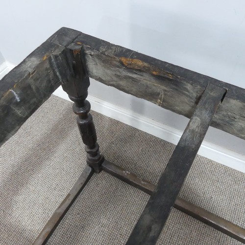 537 - An 18th century oak farmhouse Table, four planked top with cleated ends, raised on turned legs and s... 