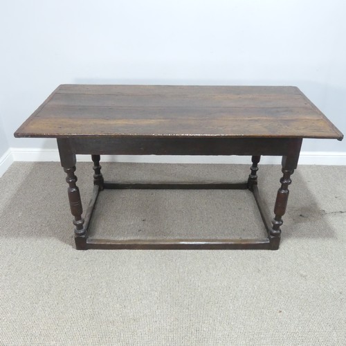 537 - An 18th century oak farmhouse Table, four planked top with cleated ends, raised on turned legs and s... 