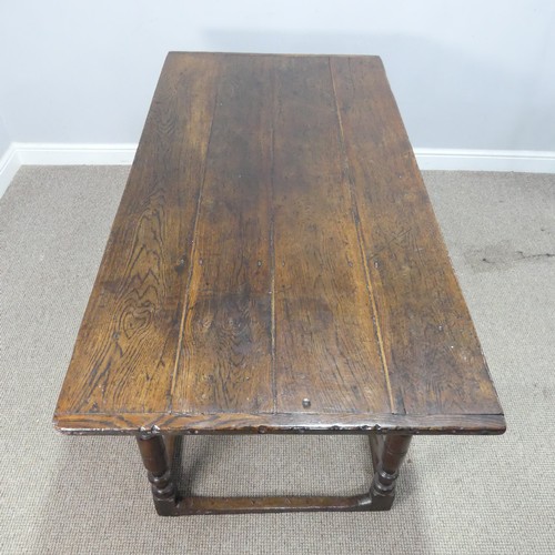 537 - An 18th century oak farmhouse Table, four planked top with cleated ends, raised on turned legs and s... 