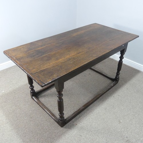 537 - An 18th century oak farmhouse Table, four planked top with cleated ends, raised on turned legs and s... 