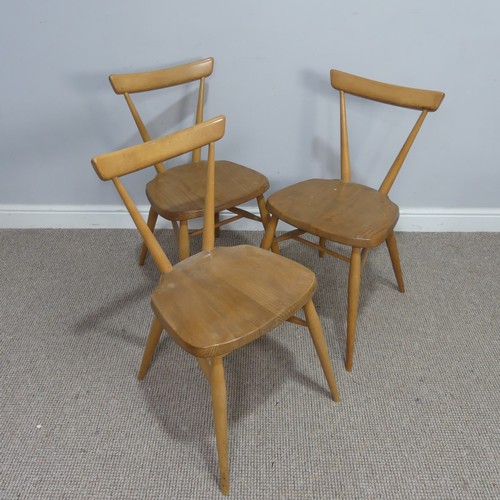 540 - A set of three mid 20th century Ercol stacking Chairs, single slat backs over shaped seats and suppo... 