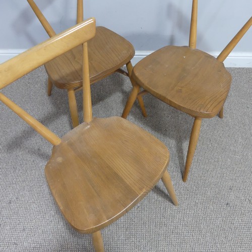 540 - A set of three mid 20th century Ercol stacking Chairs, single slat backs over shaped seats and suppo... 