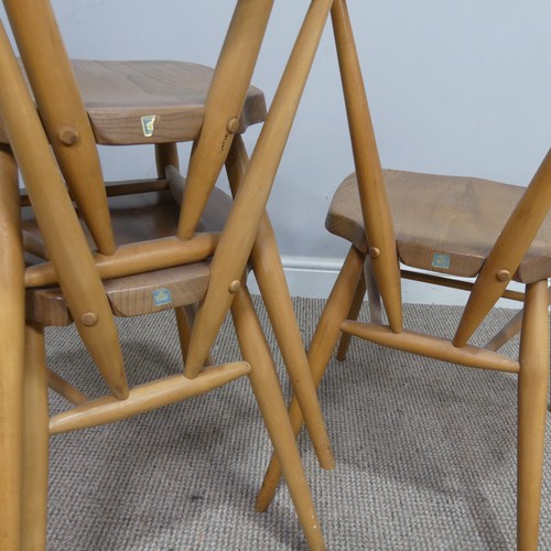 540 - A set of three mid 20th century Ercol stacking Chairs, single slat backs over shaped seats and suppo... 