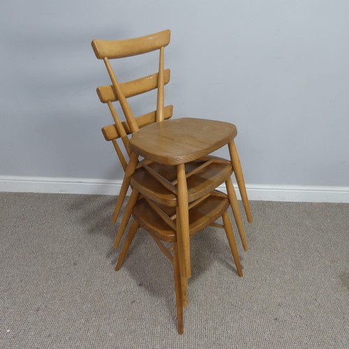 540 - A set of three mid 20th century Ercol stacking Chairs, single slat backs over shaped seats and suppo... 