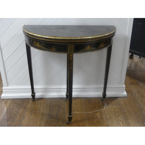 548 - An early 20th century Chinoiserie demi lune card Table, black lacquered and painted gilt decorations... 