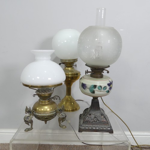 549 - Three early 20thC oil lamps, now converted to electricity, together with two ceramic based table lam... 