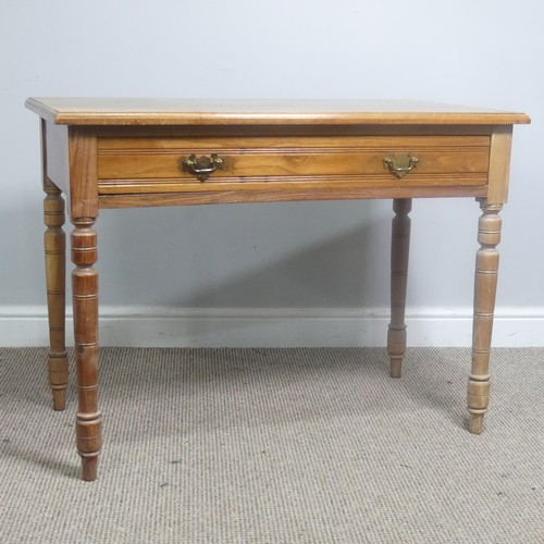 556 - An early 20th century light oak Side Table, with frieze drawer, raise on turned supports, W 92 cm x ... 