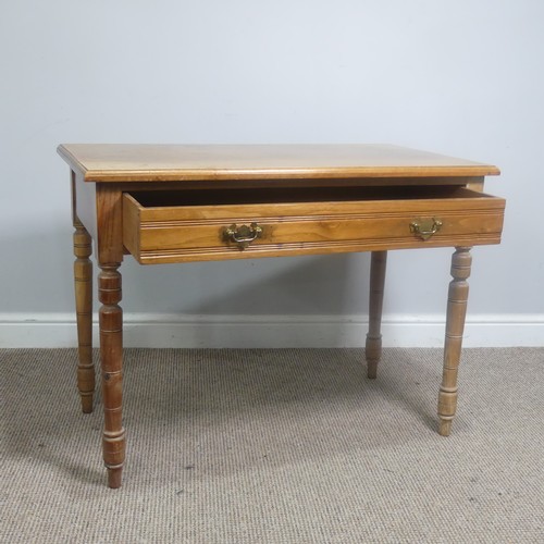 556 - An early 20th century light oak Side Table, with frieze drawer, raise on turned supports, W 92 cm x ... 