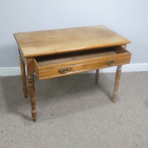 556 - An early 20th century light oak Side Table, with frieze drawer, raise on turned supports, W 92 cm x ... 