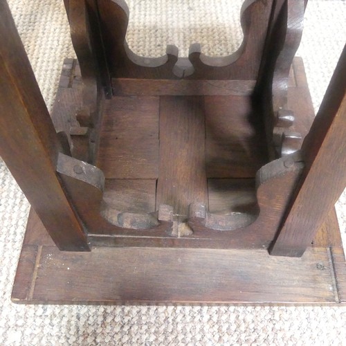 560 - An Arts and Crafts oak and copper Plant Stand, of square proportions, top over four embossed stylise... 