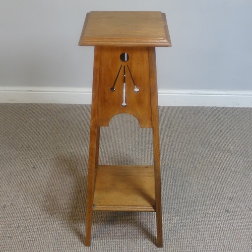 430 - An Arts and Crafts oak plant Stand with pierced apron, raised on tapering supports, W 32 cm x H 91 c... 