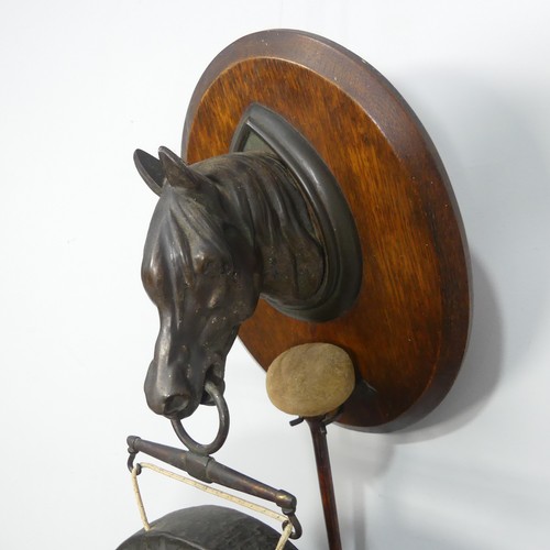 569 - An early 20th century dinner Gong in the form of a Horse, marked 'Burmese'.