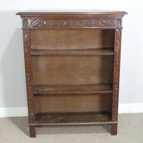 576 - A Victorian carved oak open Bookcase, with retailers plaque, W 91 cm x H 116.5 cm x D 29.5 cm.... 