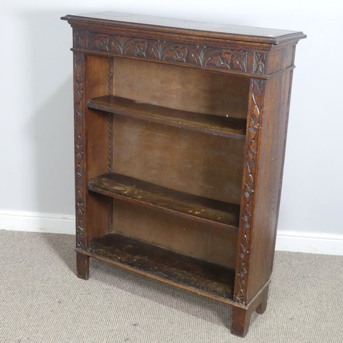 576 - A Victorian carved oak open Bookcase, with retailers plaque, W 91 cm x H 116.5 cm x D 29.5 cm.... 