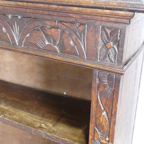 576 - A Victorian carved oak open Bookcase, with retailers plaque, W 91 cm x H 116.5 cm x D 29.5 cm.... 