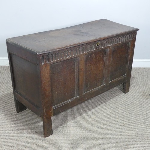 579 - A 17th century and later oak three panel Coffer, rectangular top over carved frieze and three panels... 