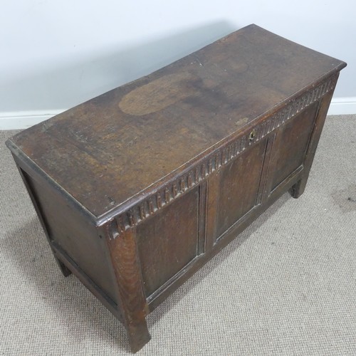 579 - A 17th century and later oak three panel Coffer, rectangular top over carved frieze and three panels... 