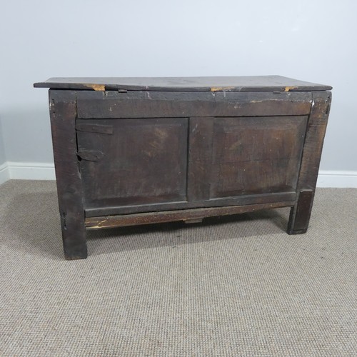 579 - A 17th century and later oak three panel Coffer, rectangular top over carved frieze and three panels... 