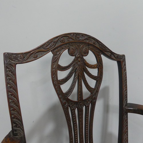 581 - A Georgian elbow Chair, with carved and pierced slat back and tapestry seat.