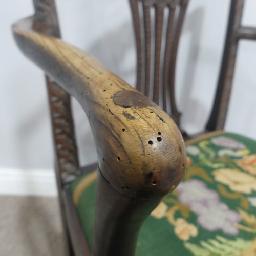 581 - A Georgian elbow Chair, with carved and pierced slat back and tapestry seat.