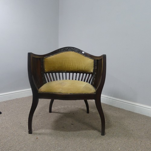 431 - An Edwardian mahogany tub Armchair, with spindle back and arm rests, above serpentine front upholste... 