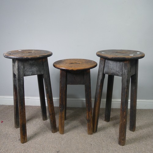 427 - Three antique stained pine kitchen Stools, with oval tops and pierced handles, raised on chamfered s... 